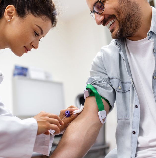 Nurse drawing a blood sample for lab testing at Elon Health Urgent Care in Davenport, FL