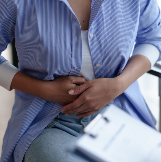 Provider discussing constipation relief with a patient at Elon Health Urgent Care in Davenport, FL