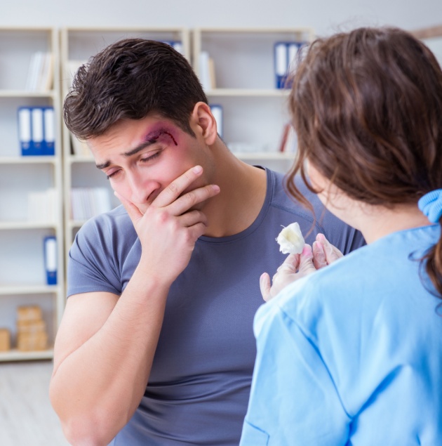 Provider cleaning and dressing a wound at Elon Health Urgent Care in Davenport, FL