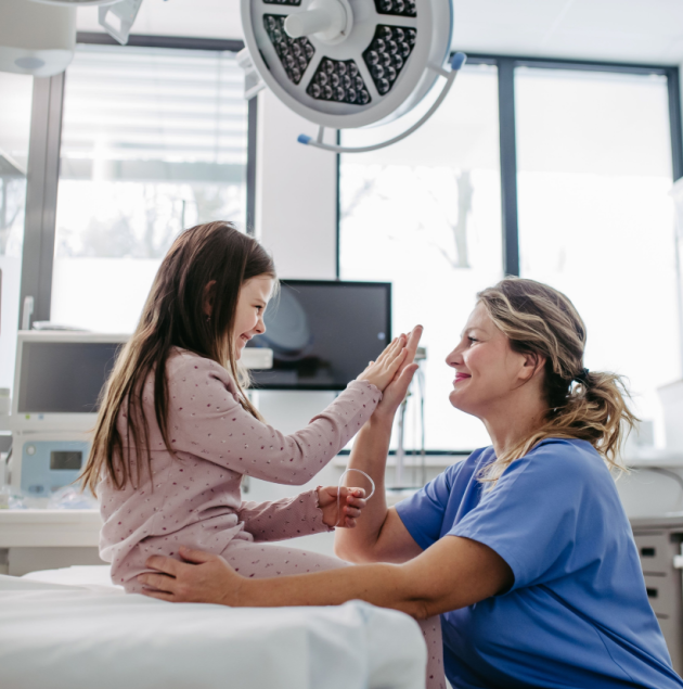 Pediatric provider examining a child at Elon Health Urgent Care in Davenport, FL